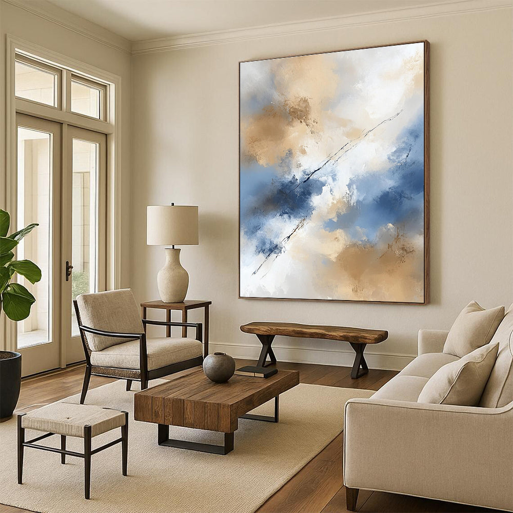 Large abstract painting in beige and blue tones features white clouds creating an ethereal ambiance with delicate brushstrokes and flowing lines.STSC409