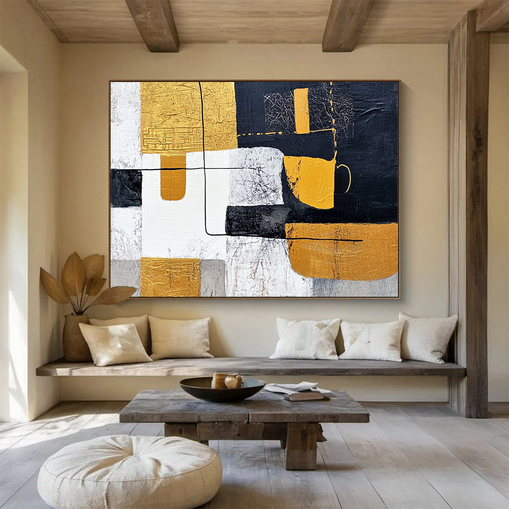 Large abstract painting featuring white and yellow shapes with black lines on a dark gray background inspired by Chinese landscapes and embellished with gold leaf.SC266