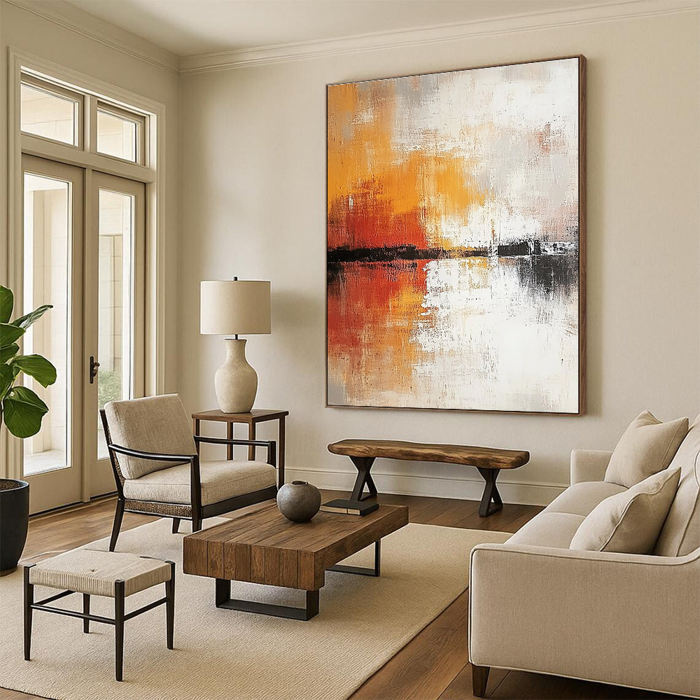 Large abstract painting in soft white and grey tones with warm orange and yellow accents featuring expressive brush strokes and rich texture.STSC813