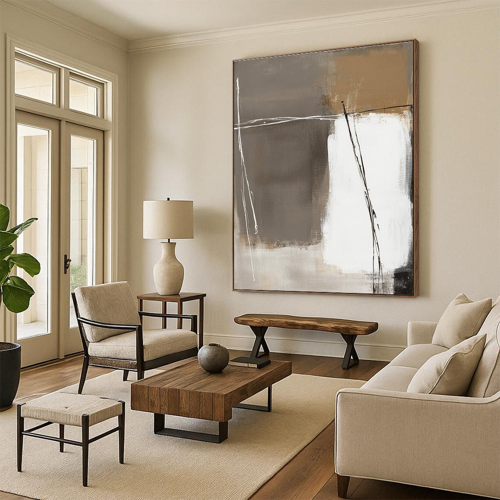 Large abstract painting in white and beige with brown accents on a dark gray background featuring thick brush strokes and hand-drawn lines.STSC564