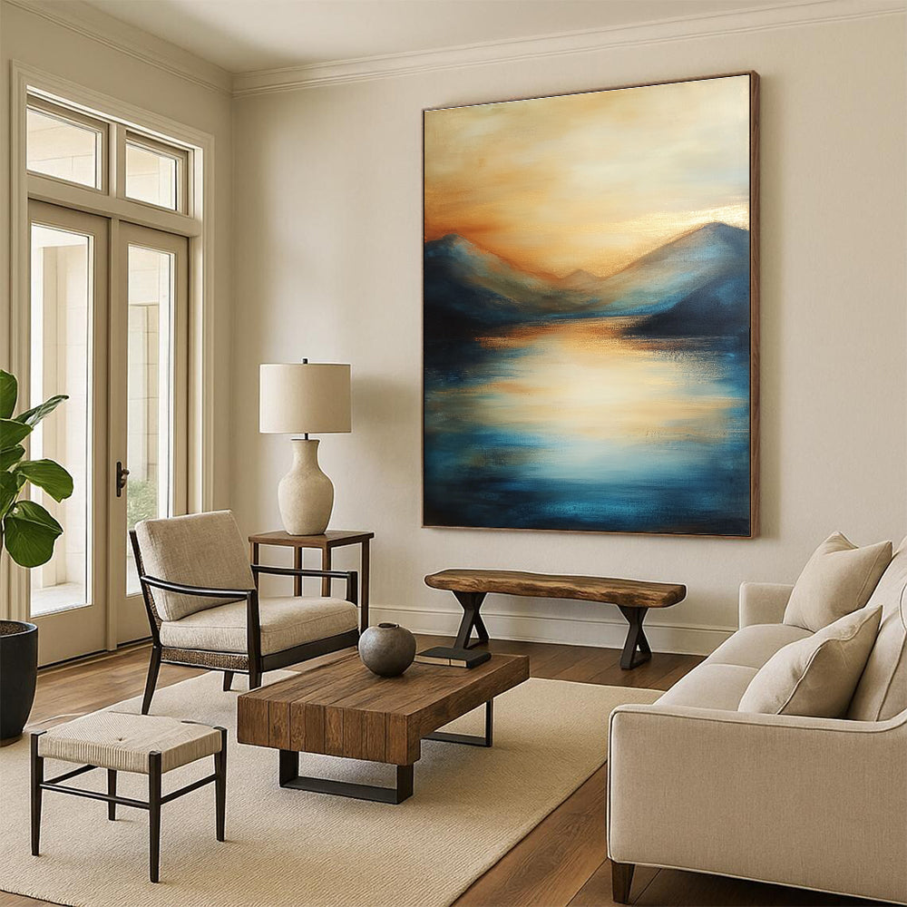 Large abstract painting of the sea featuring soft brush strokes with blue tones and golden accents creating a serene sunset atmosphere.STSC092