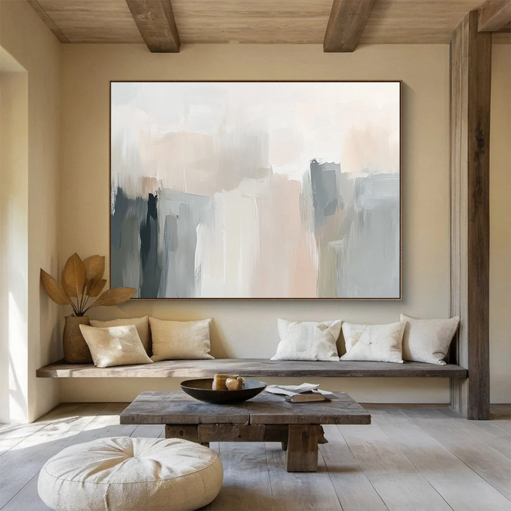 Large abstract painting in soft neutral tones with gentle brushstrokes and subtle color transitions creating an elegant atmosphere.SC058