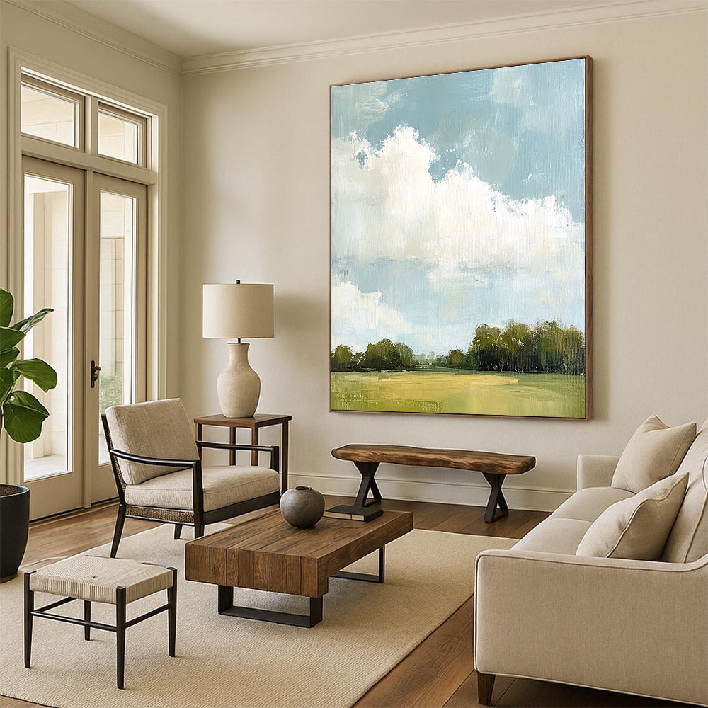 Large abstract painting depicting distant clouds and lush greenery with soft hues and thick brush strokes.STSC874