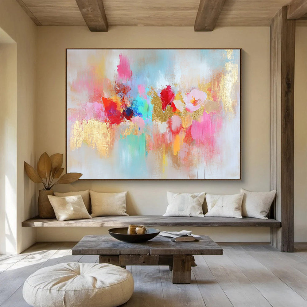 Large abstract painting with vibrant colors and gold leaf accents symbolizing happiness creativity and hope on a soft textured white background.SC264