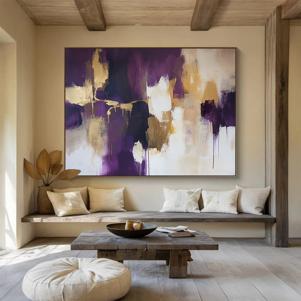 Large abstract painting with gold leaf highlights in shades of purple and beige accented by soft white edges creating a stunning composition.SC237
