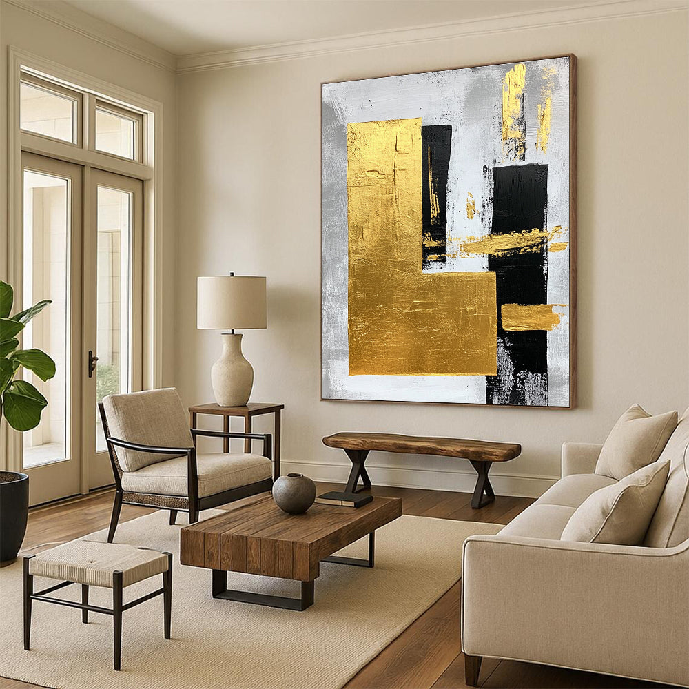 Large abstract art painting featuring gold foil bold strokes and minimalist black lines on a gray background creating an elegant atmosphere.STSC015