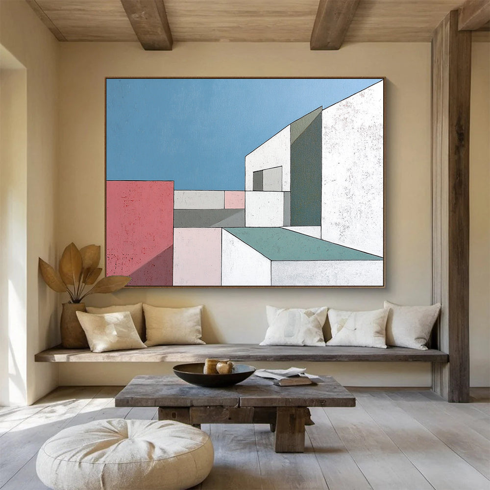 A large abstract painting featuring minimalist white buildings with large windows against a serene blue sky highlighting sharp color contrasts and geometric shapes.SC487