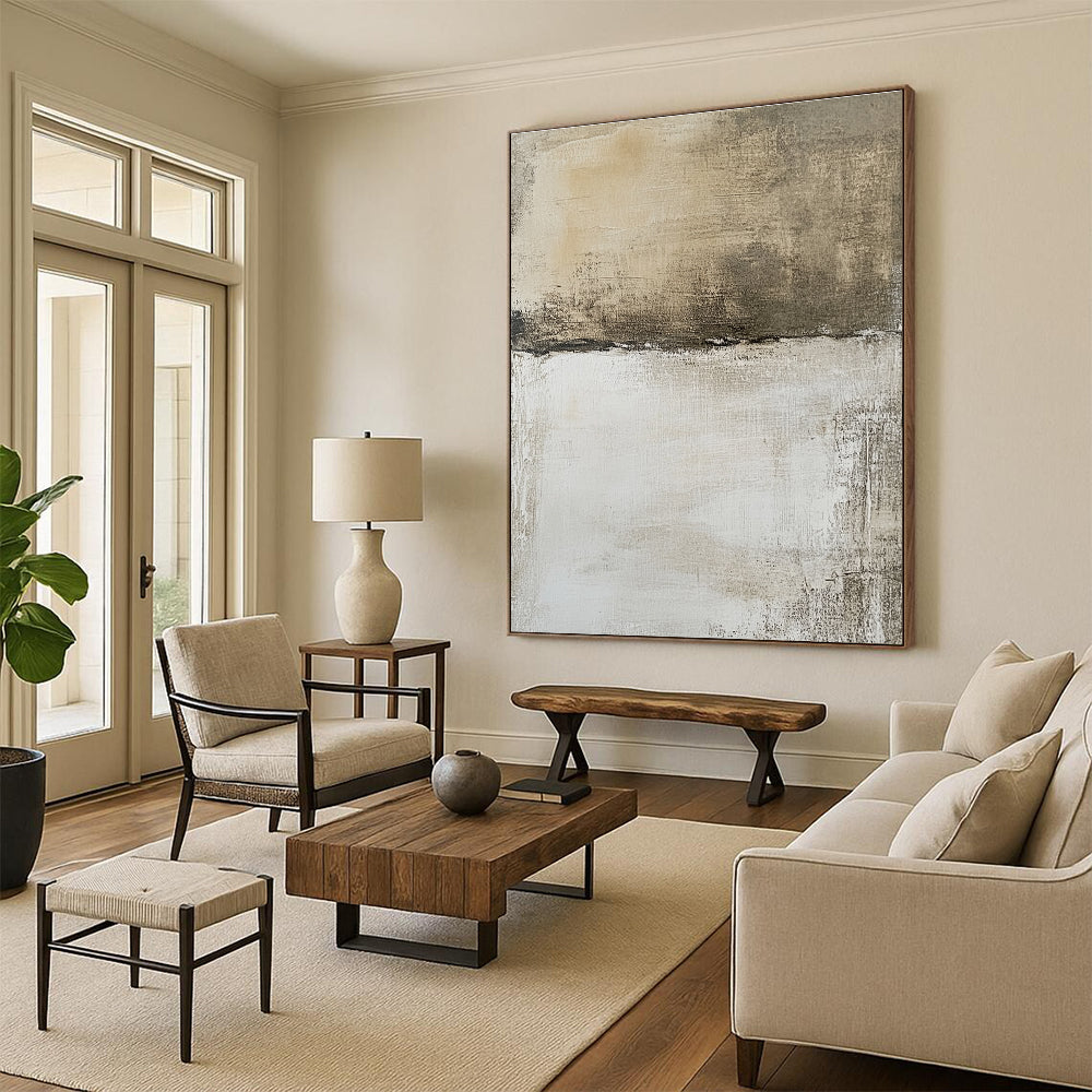 Large abstract painting features a neutral background with faded textures and brown shapes, evoking an aerial view of a landscape.STSC1103