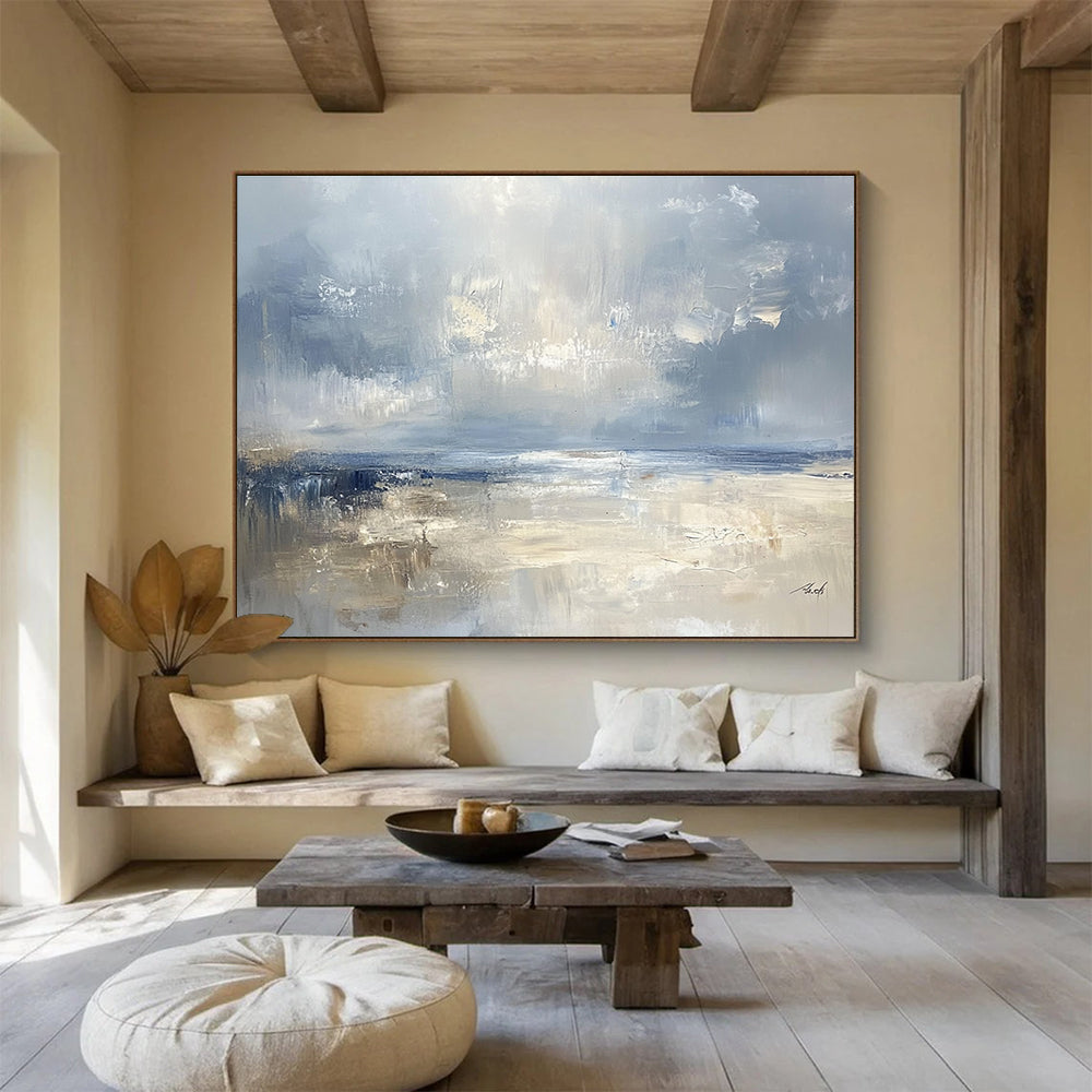 Large abstract seascape in cool blues and grays with warm beige accents capturing serene coastal beauty and a misty horizon.SC278