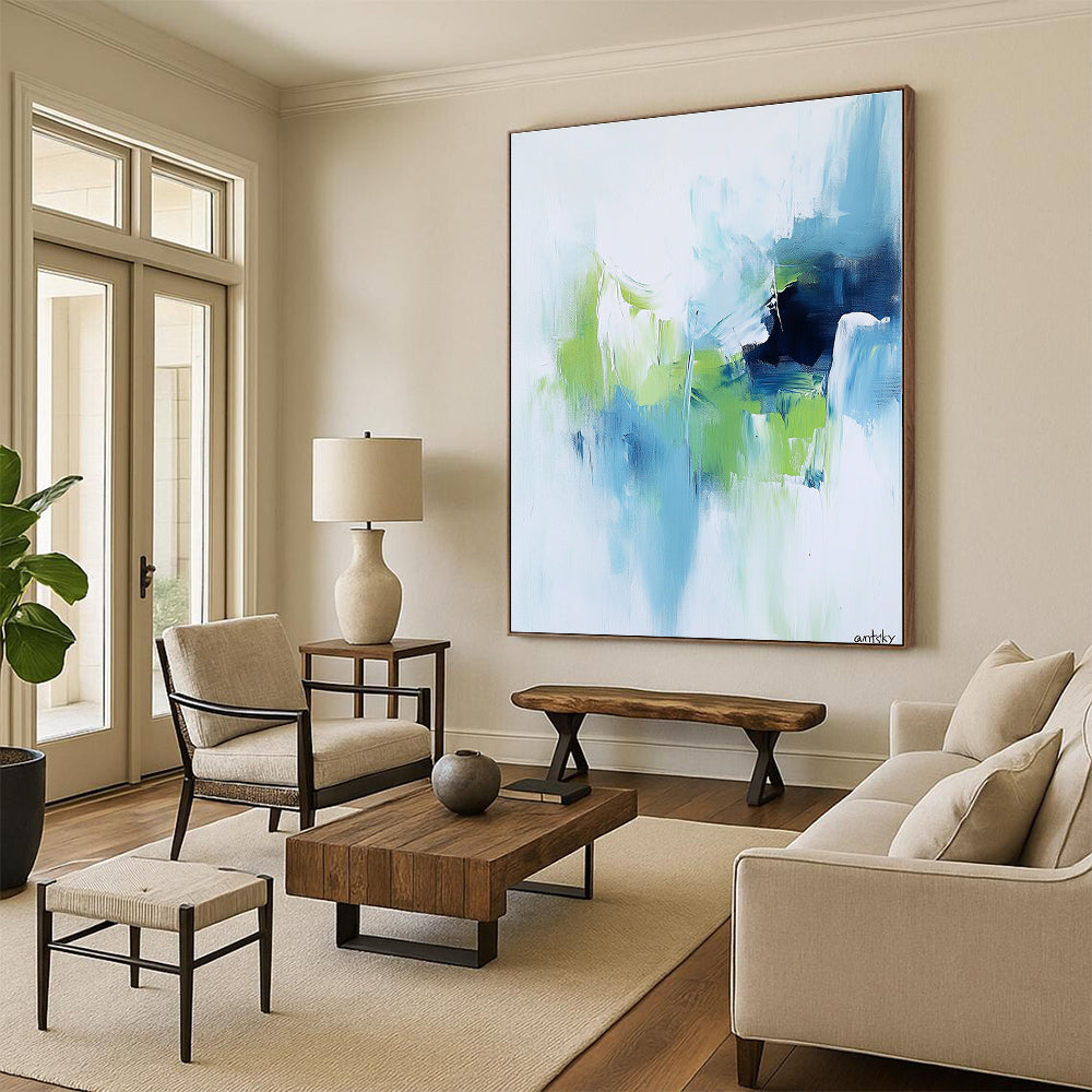 Large abstract painting featuring white blue and green tones with antsky in the lower right corner.STSC826