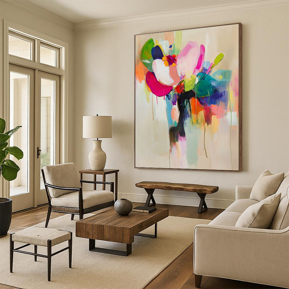 Large abstract painting featuring vibrant colors and soft brushstrokes with a flower in a vase on a light beige background.STSC822