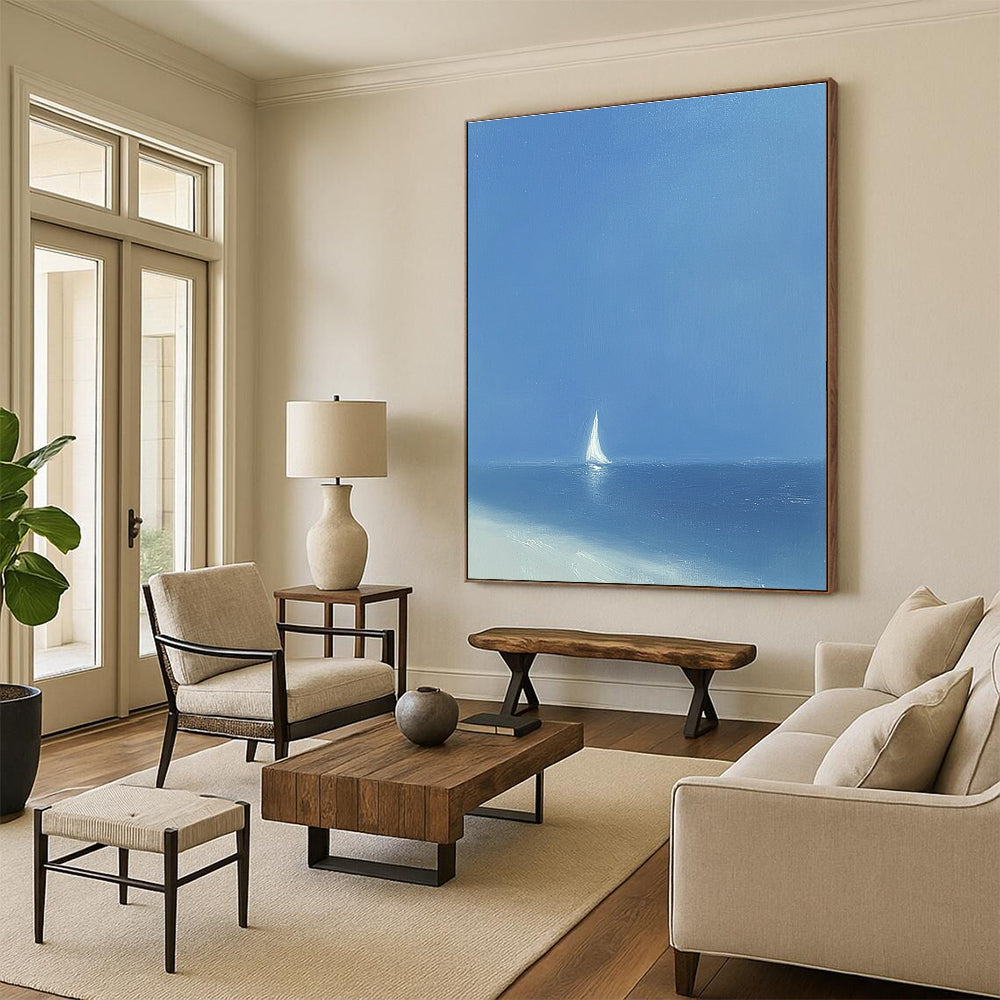 A large abstract painting featuring a minimalist white sailboat on the ocean under a blue sky with soft tones and wide brush strokes.STSC1062