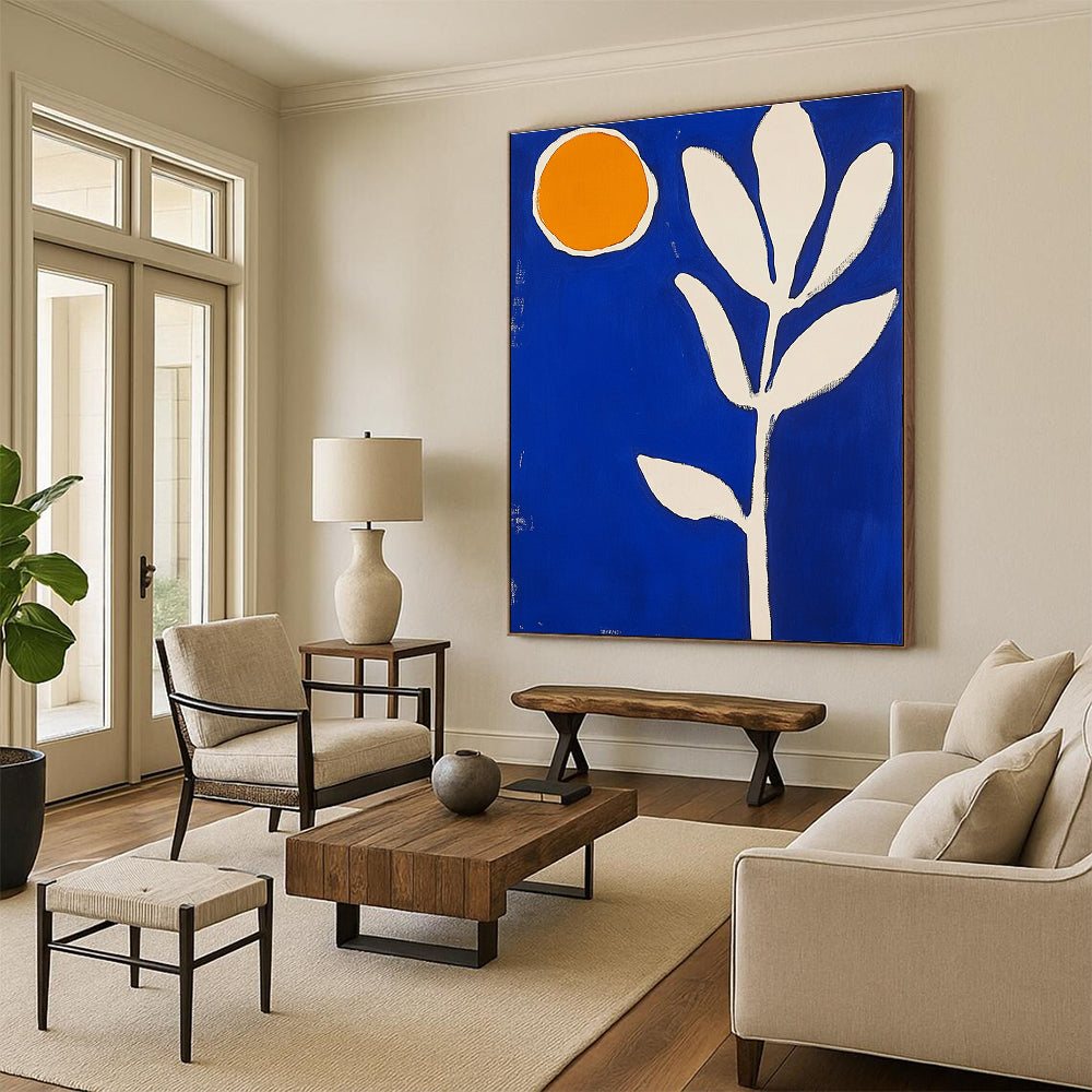 Large abstract painting featuring blue and white shapes an orange sun and a thick brush stroke flower in vibrant colors.STSC1316