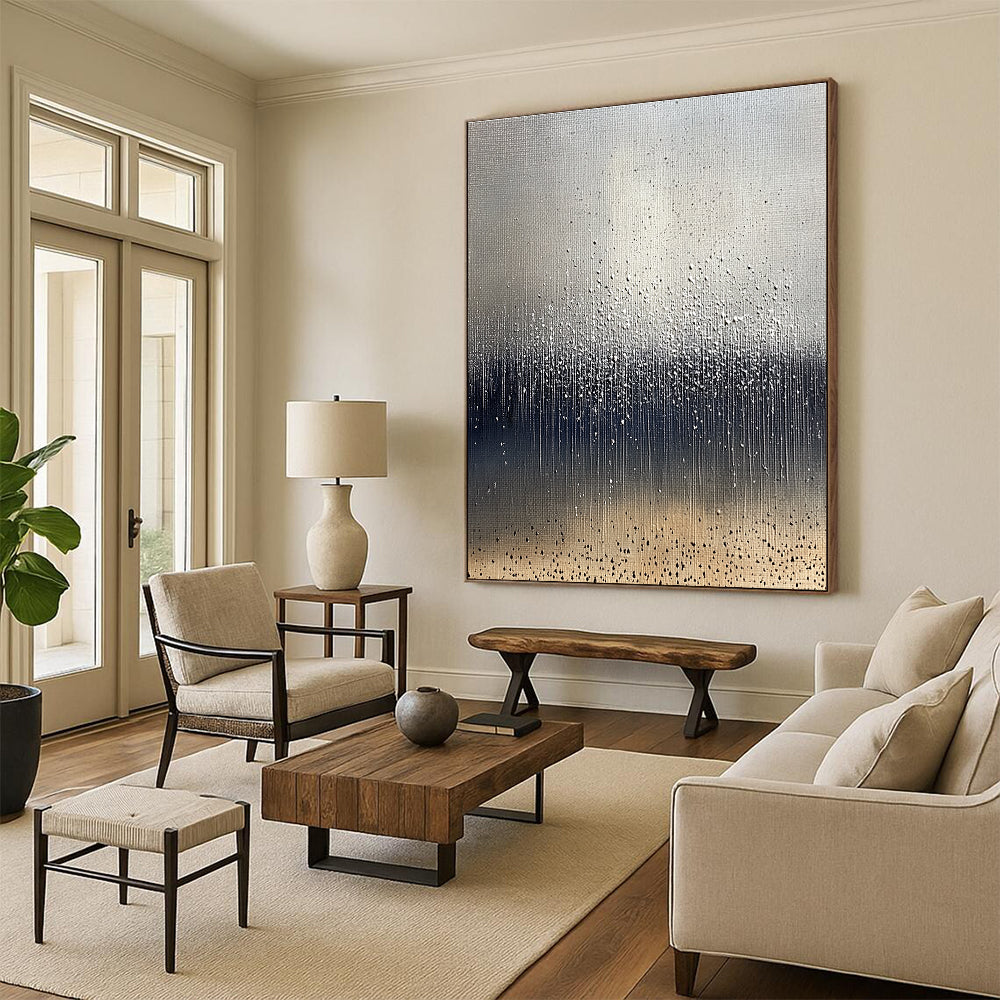 Large abstract painting depicting raindrops on brown soil with a cool gray background and splashing water droplets in dark blue and white tones.STSC1399