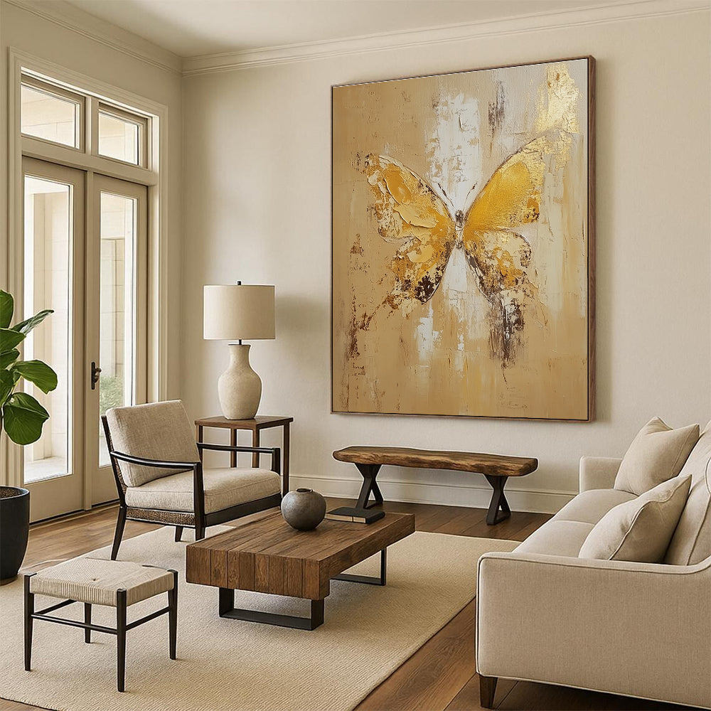 Large abstract painting of a butterfly in light yellow and beige tones with gold leaf and textured oil on canvas.STSC252