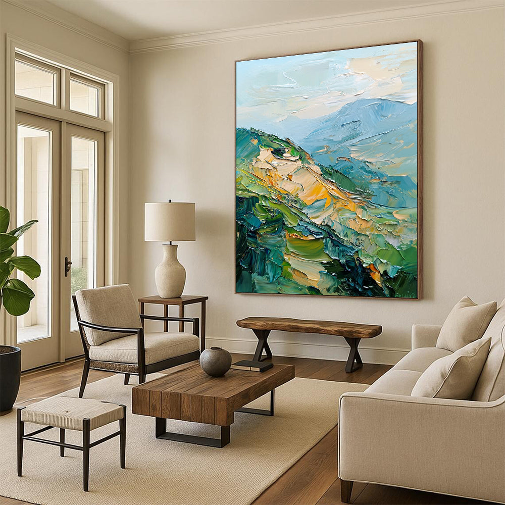 Large abstract painting of mountains featuring palette knife texture and thick brush strokes in a blend of greens blues and golds.STSC192