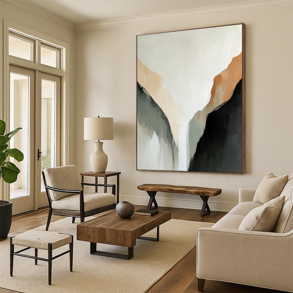 Large abstract painting of a tranquil mountain range in muted beige and black tones against a serene white background.STSC652