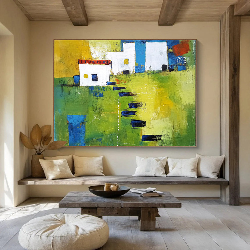 Large abstract painting showcasing green fields, white buildings with blue lines, and black stairs, featuring thick brush strokes and vibrant geometric shapes.SC193