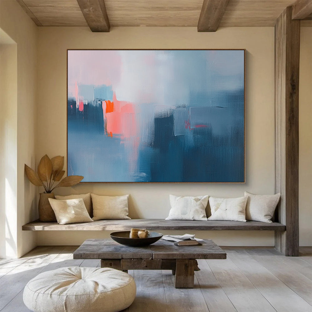 Large abstract oil painting depicting a misty rain with blue and grey hues highlighted by pink and orange accents.SC319