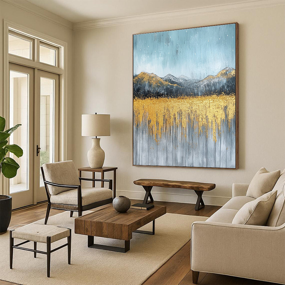 Large abstract painting with gold and silver on textured canvas featuring a serene sky golden mountains and soft gray grass.STSC097