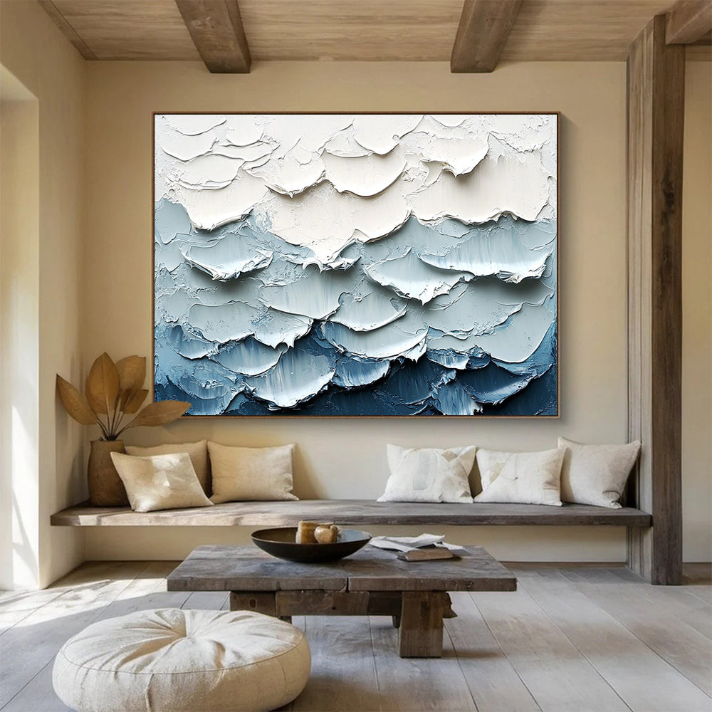 Large abstract painting of waves featuring a white and blue color palette with thick impasto texture for a striking visual effect.SC205