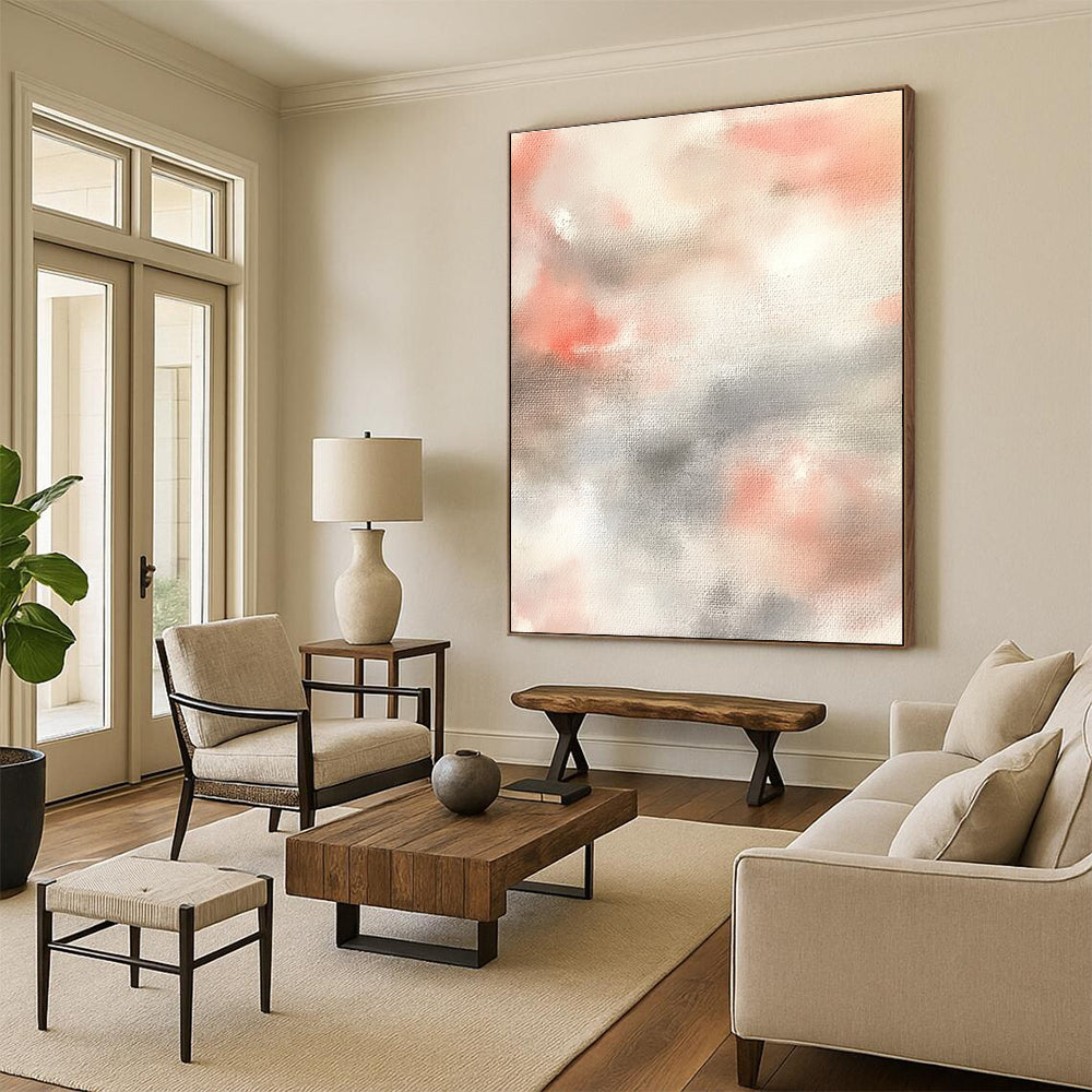 Large abstract painting featuring soft pinks whites and light gray clouds on a beige background creating a serene atmosphere.STSC1462