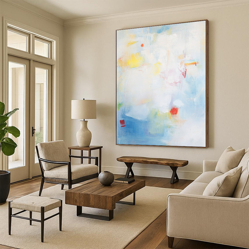 Large abstract painting with a light blue background and soft strokes depicting the sea with waves rocks and fishing boats.STSC401