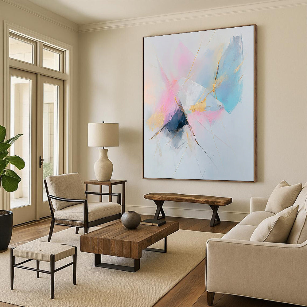 Large abstract painting featuring pastel pink and blue tones with gold accents on a white background creating a serene and calming atmosphere.STSC783