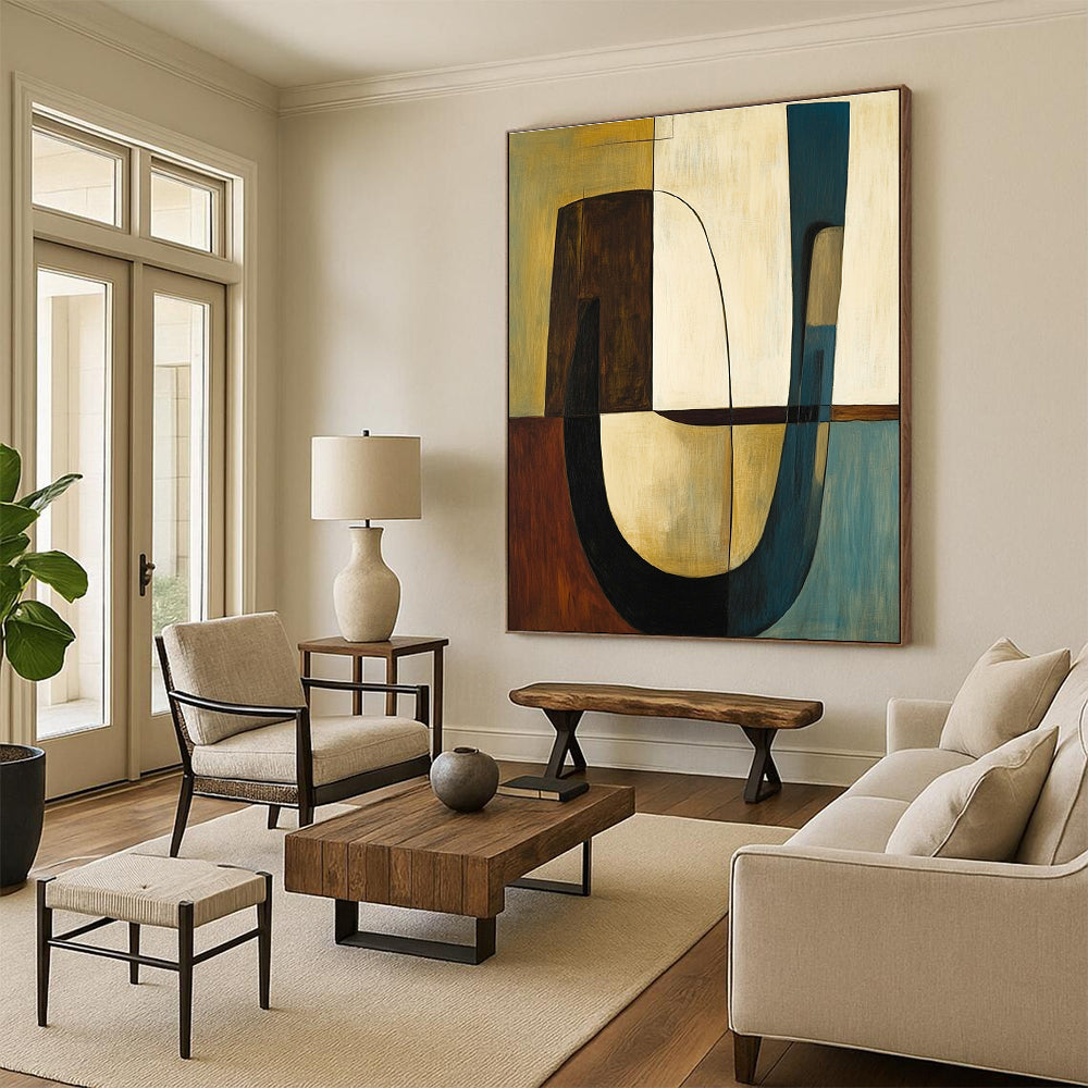 Abstract painting featuring shapes and lines in olive green with brown accents complemented by a large curved table and two chairs.STSC693