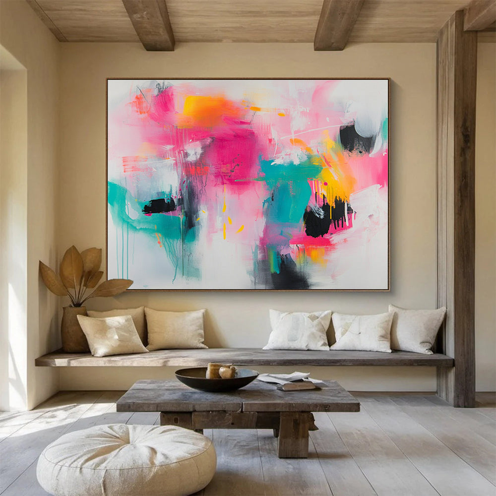 Large abstract painting featuring vibrant splashes of pink teal and yellow on a white background with loose brushstrokes and chaotic shapes.SC387