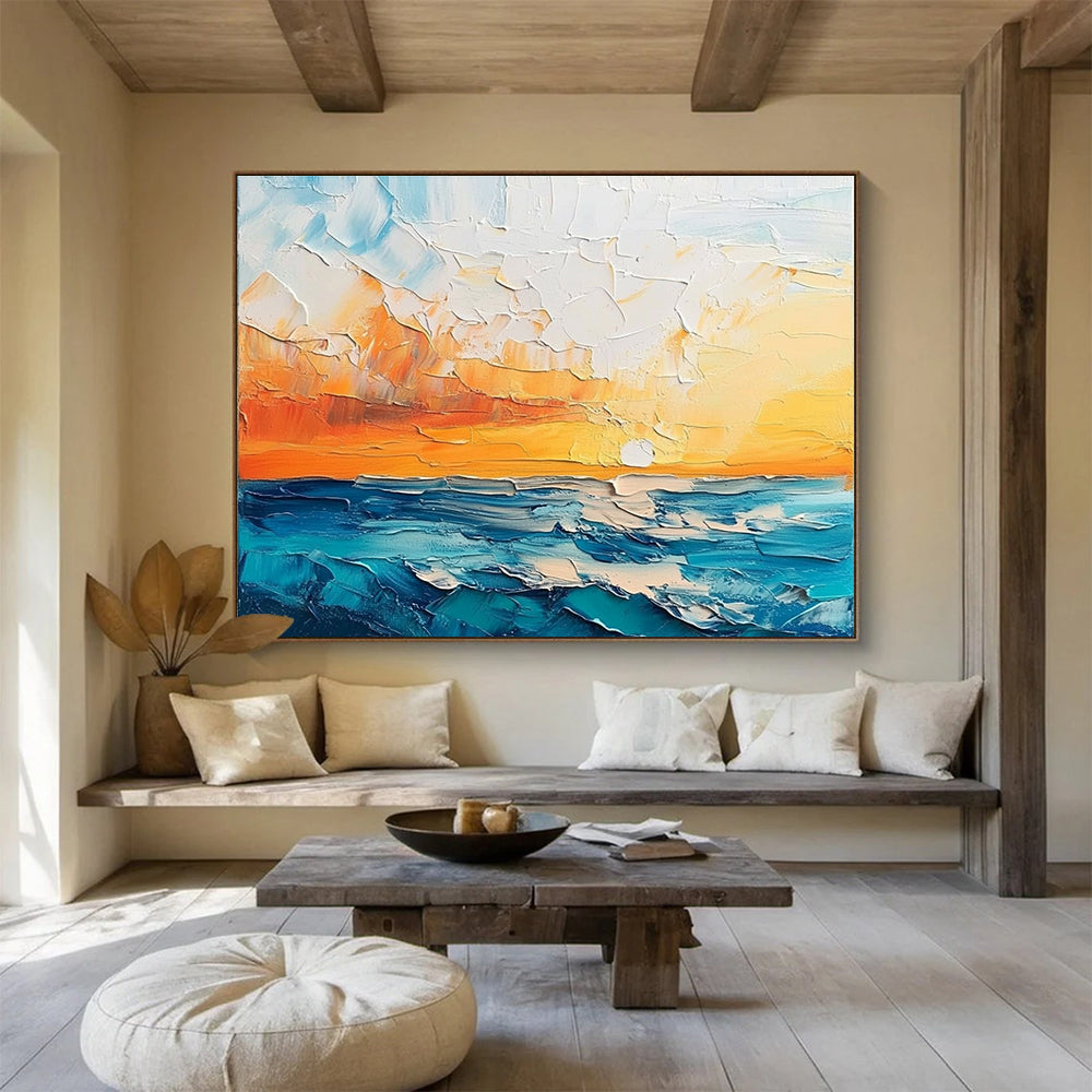 Large abstract painting featuring a textured sunset over the sea and sky in orange blue white and teal shades.SC132
