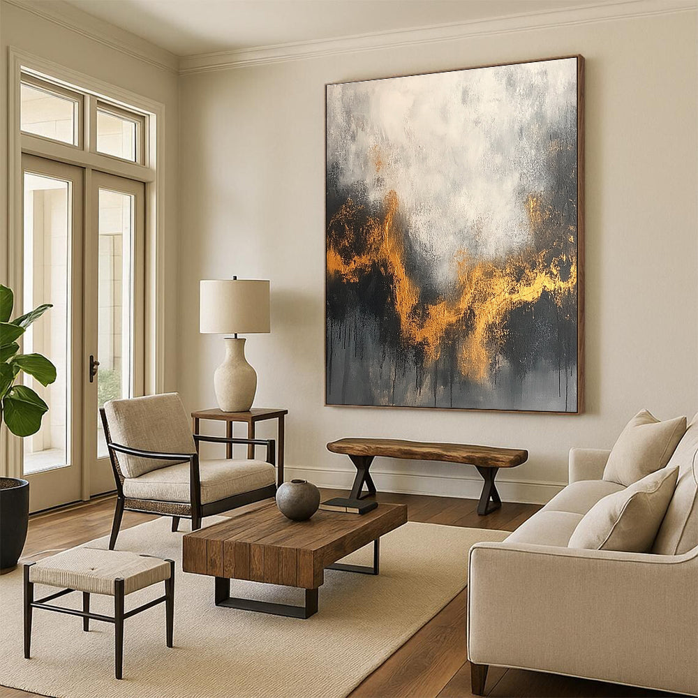 Large abstract painting with a gray and white background accentuated by gold tones and dark colors for an atmospheric effect.STSC394