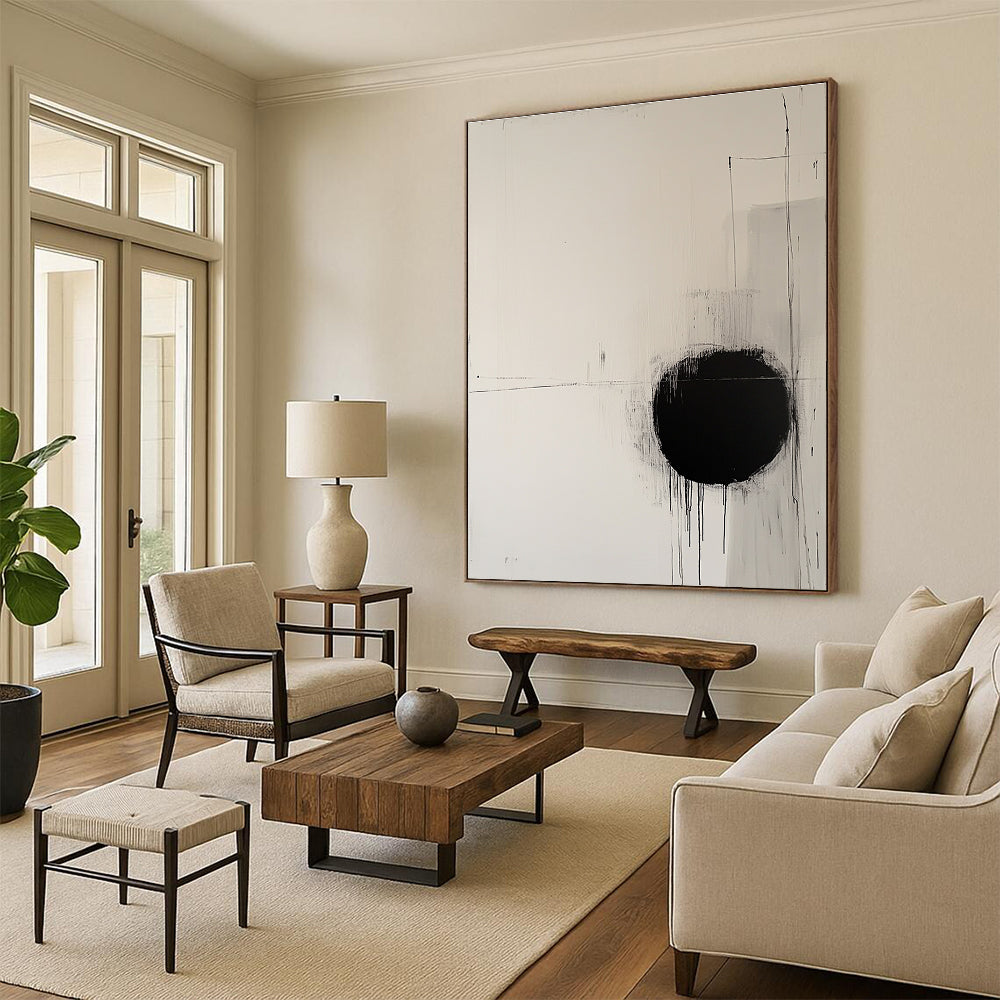 Large abstract painting featuring a round black circle on off-white canvas surrounded by delicate lines evoking movement and tranquility.STSC1067