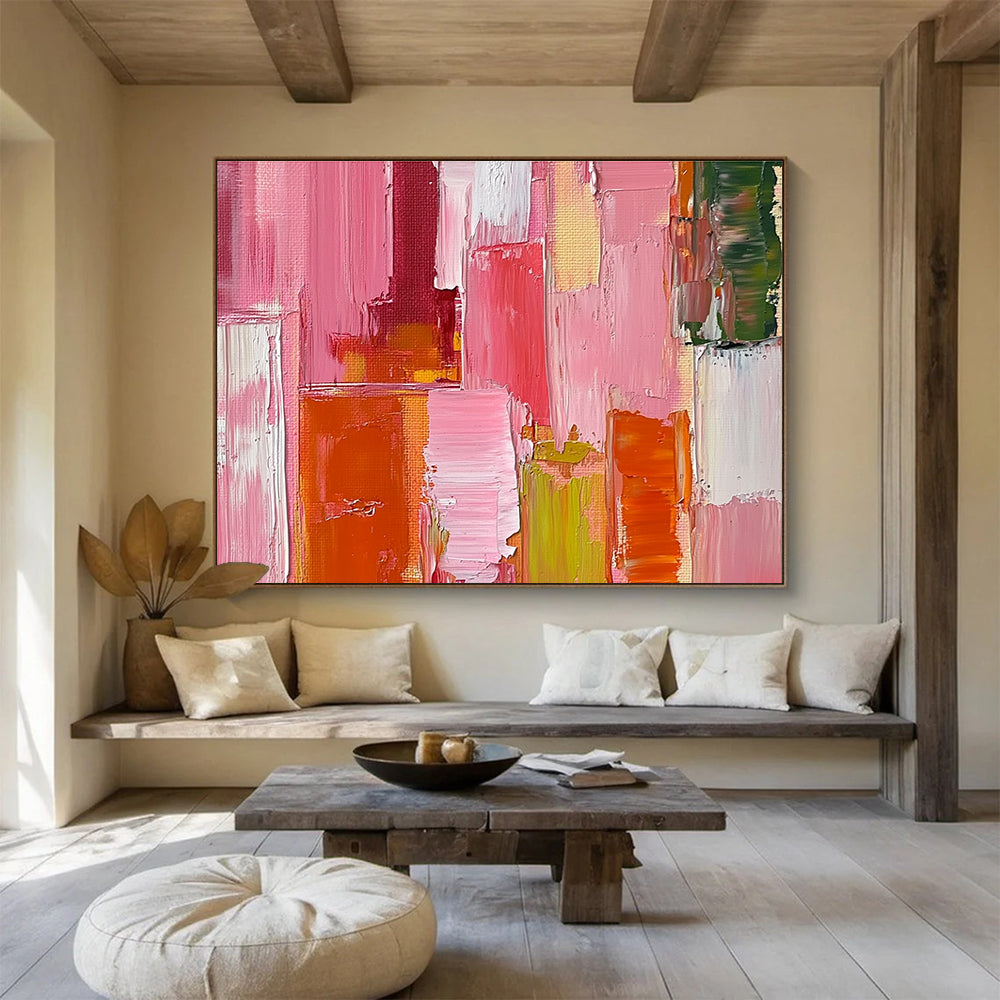 Large abstract oil painting featuring a pink orange and red cityscape with thick brush strokes and a soft impressionist style.SC118