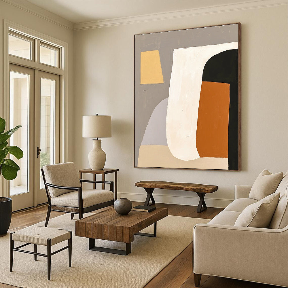 Large abstract painting featuring white shapes with an orange and black form against a grey background embodying minimalism and elegance.STSC628