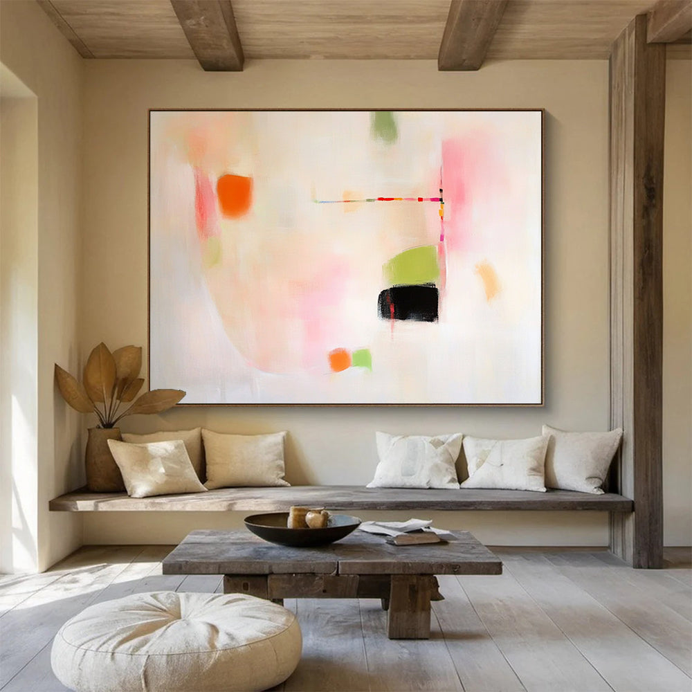 Large abstract painting featuring pink green and orange shapes on white background evoking calmness with gentle curves and contrasting black spaces.SC379
