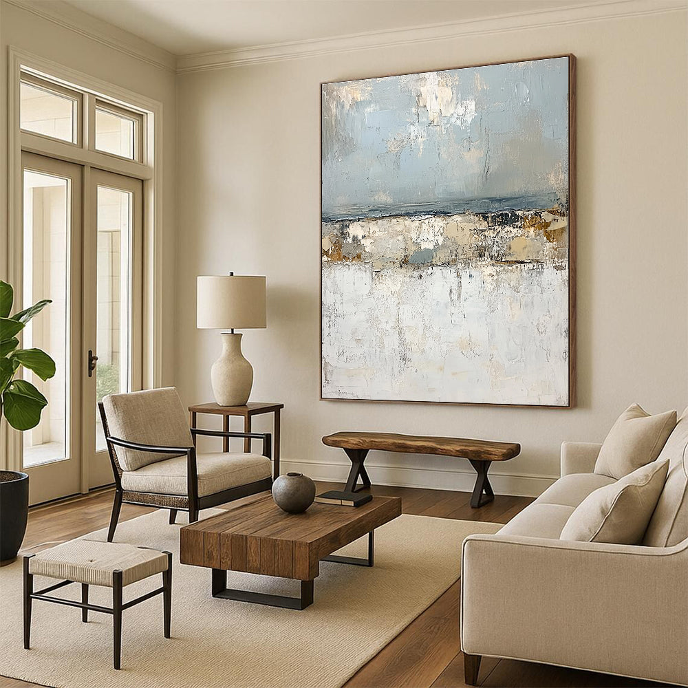 Large abstract painting of the open sea featuring impasto textures light blue and gray tones with serene landforms in white creating a tranquil atmosphere.STSC270