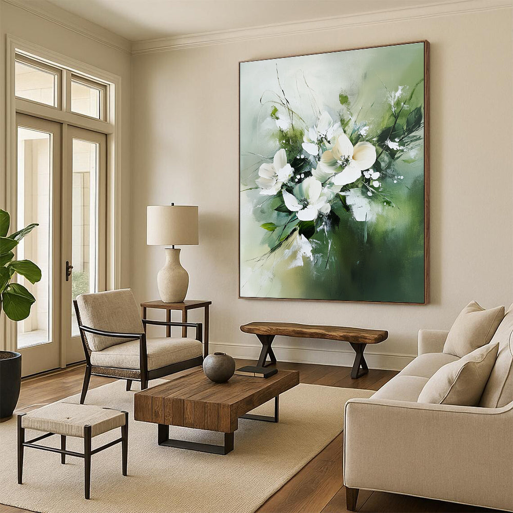 Large abstract painting featuring white flowers and green leaves in neutral tones against a soft green blurry background.STSC365