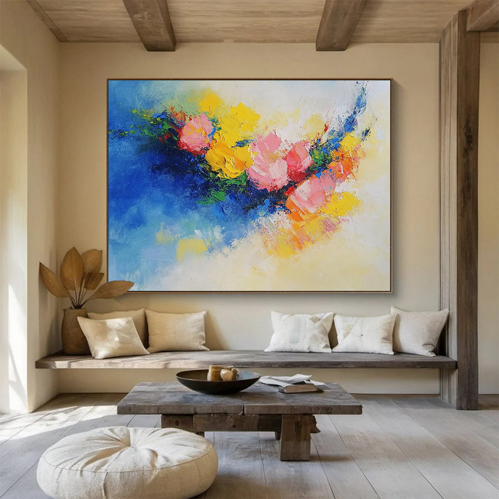 Large abstract painting of flowers in vibrant yellow, blue, and pink featuring textured palette knife techniques. Perfect for modern decor.SC190