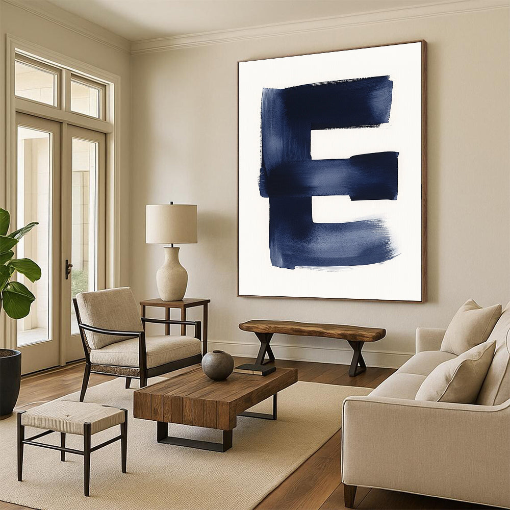 A large abstract painting featuring a minimalist watercolor letter E in navy blue against a white background emphasizing negative space and soft tones.STSC1096