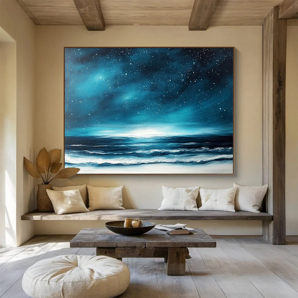A large abstract painting featuring a dark blue sky with stars and ocean waves, accented with white and light teal hues.SC396