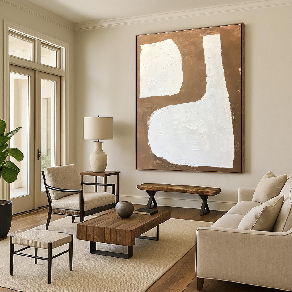 Large abstract painting featuring white shapes on a brown background with textured brushstrokes in a minimalistic style.STSC1484