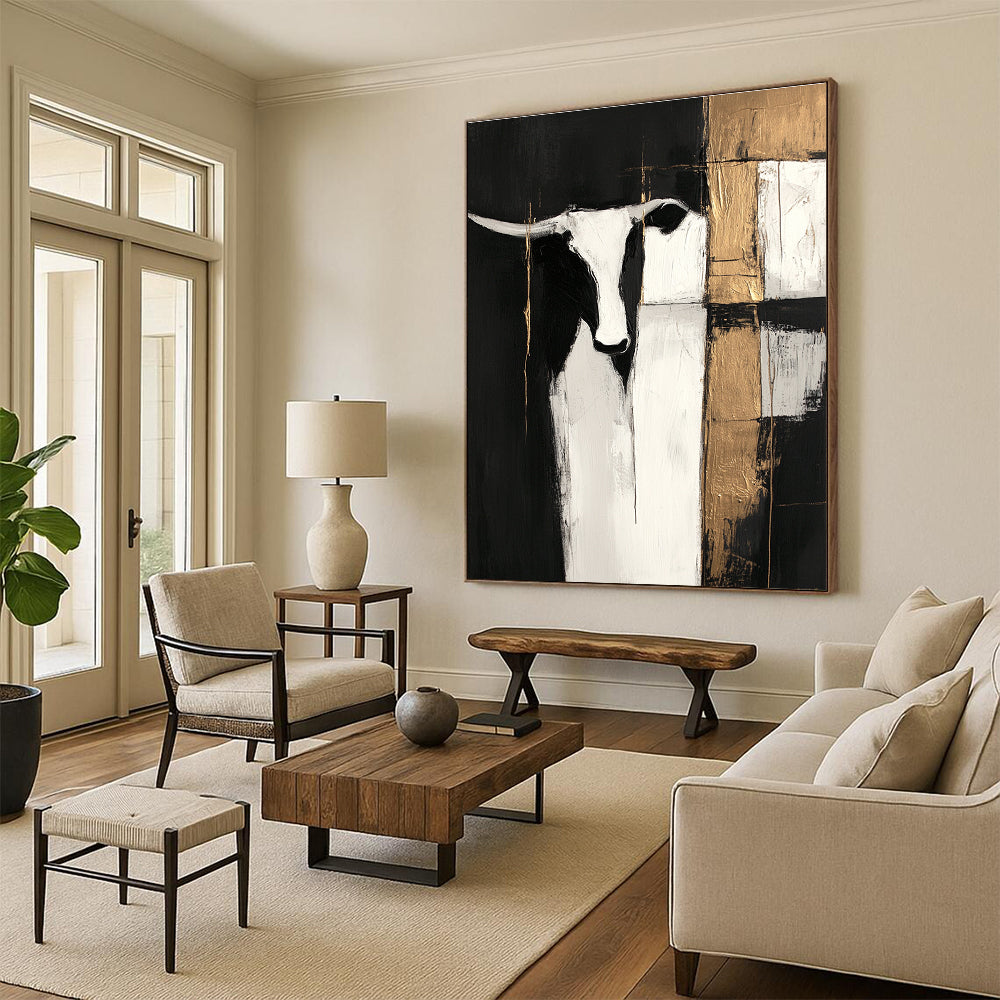 Large abstract painting in black and white with gold accents featuring cow shapes and wood planks on a dark background with visible brush strokes.STSC223