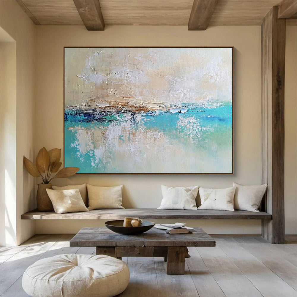 Large abstract painting of a calm sea featuring blue and green tones on a textured canvas with soft edges and neutral colors.SC340
