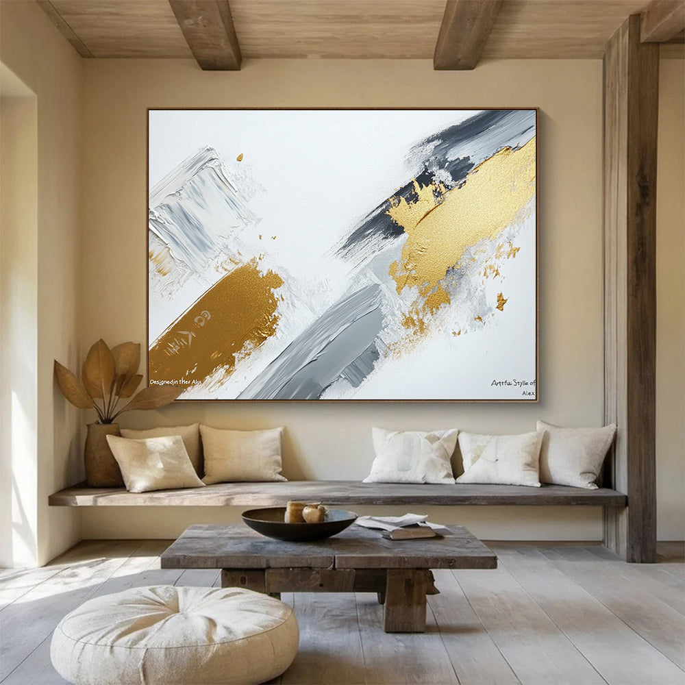 Large abstract painting featuring gray and gold brush strokes on a white background showcasing contemporary artistic creativity and elegance.SC293