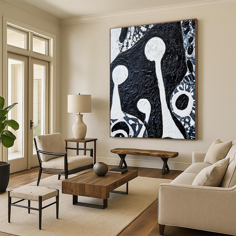 Large abstract painting featuring bold black and white patterns with tribal art elements and two figures holding musical instruments on textured canvas.STSC937