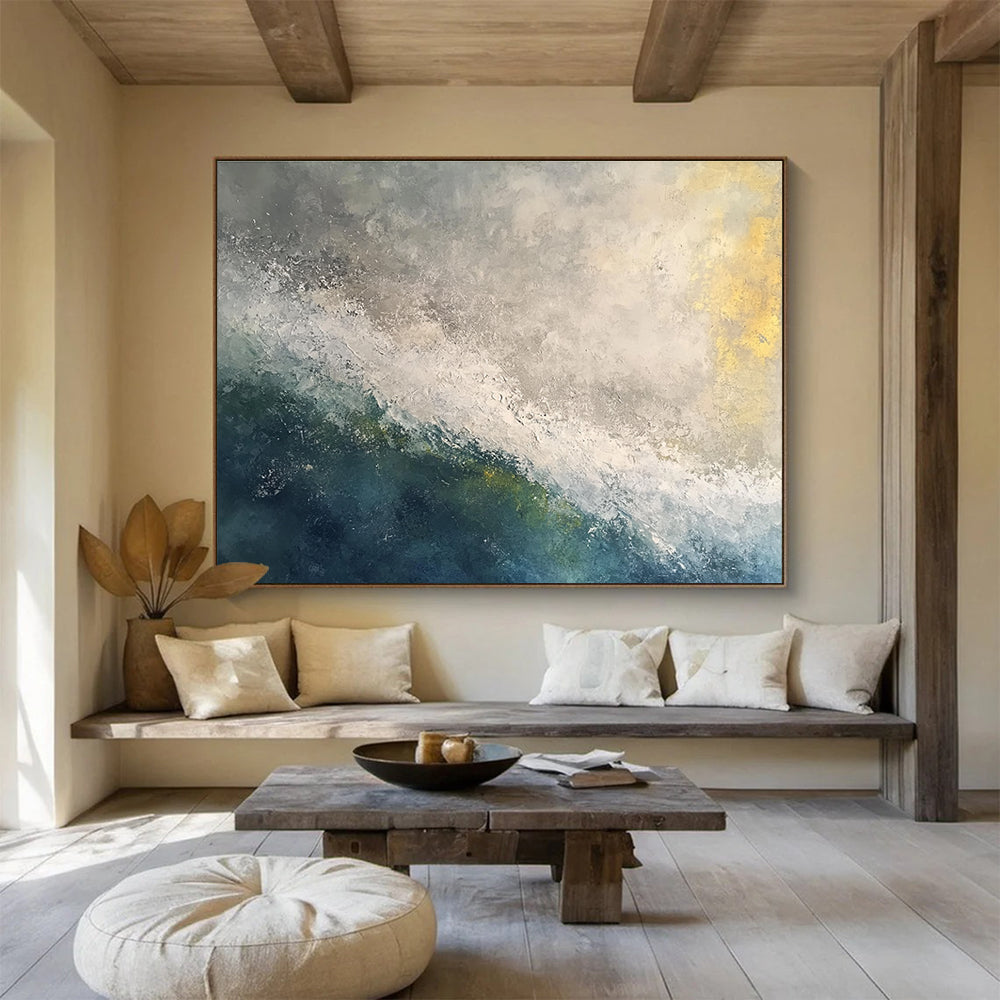 Large abstract oil painting of a stormy ocean at dawn featuring white and grey tones with touches of blue green and yellow.SC119