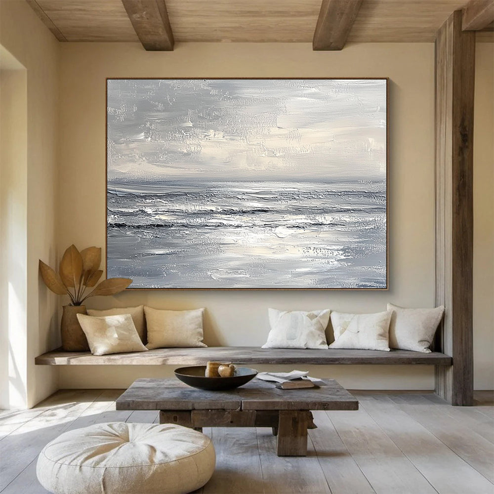 Abstract seascape in impasto oil, featuring textured strokes in muted whites and greys, capturing a minimalist beach with soft waves and sky.SC276