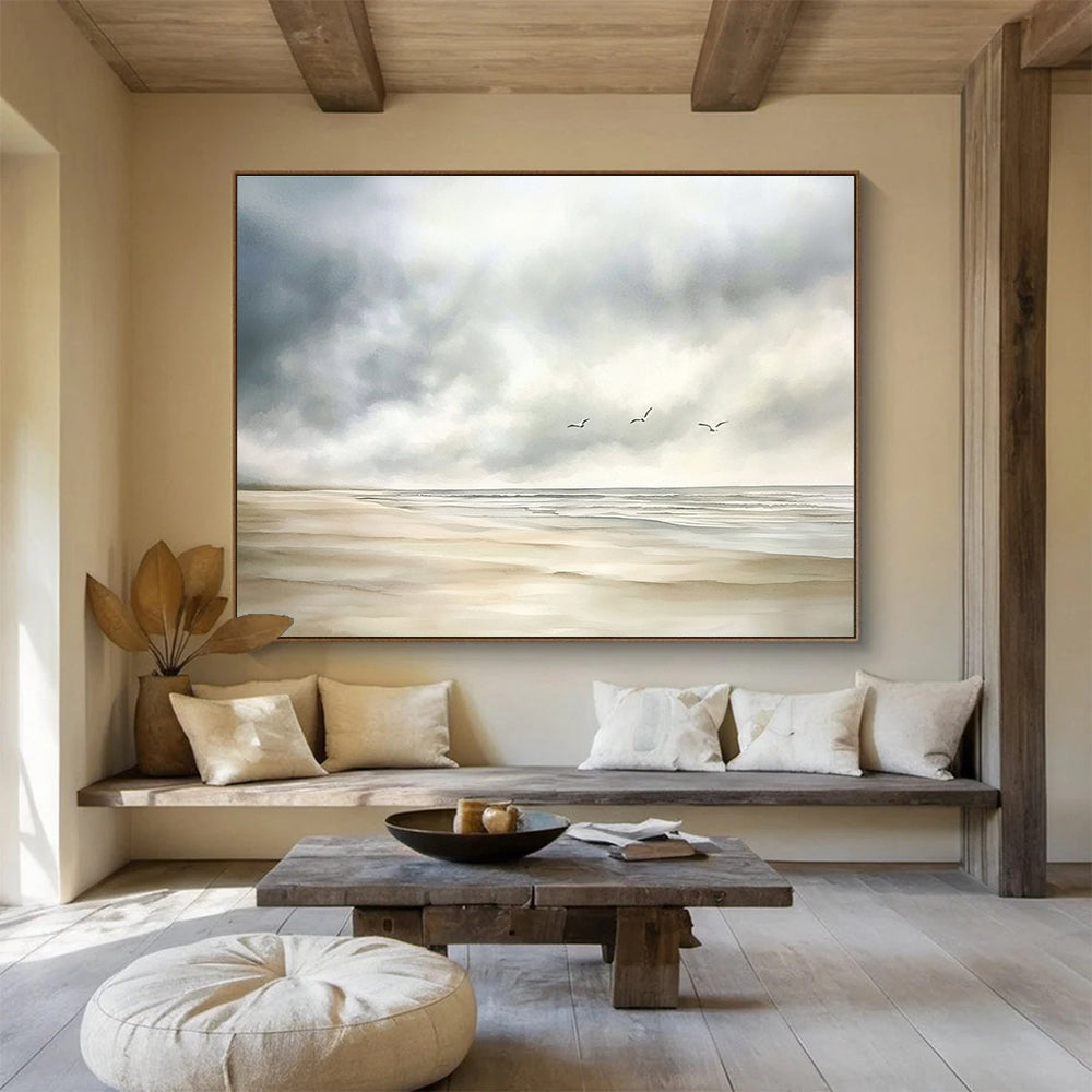 Large abstract watercolor depicting a calm beach scene with muted colors, seagulls in the distance, and a soft cloudy sky on a white background.SC616