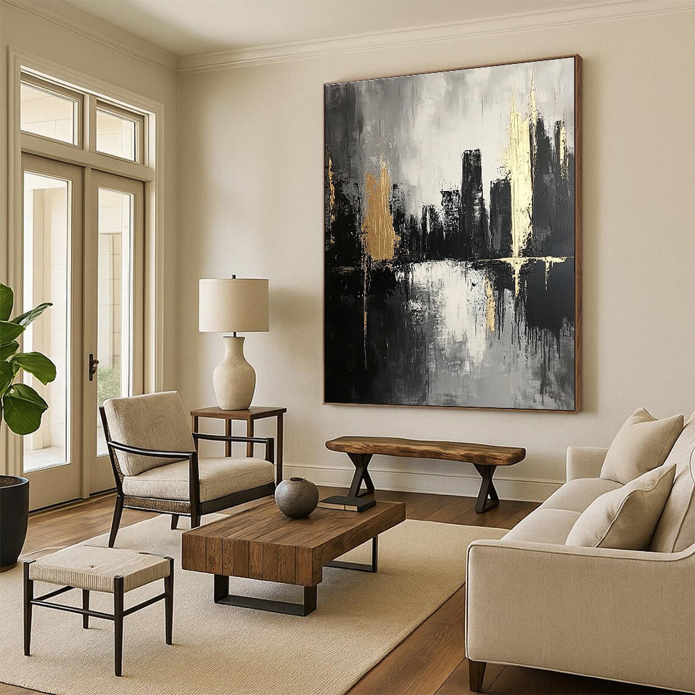 Large abstract painting featuring thick brush strokes in dark grays and subtle gold highlights creating an atmospheric monochromatic cityscape on canvas.STSC020
